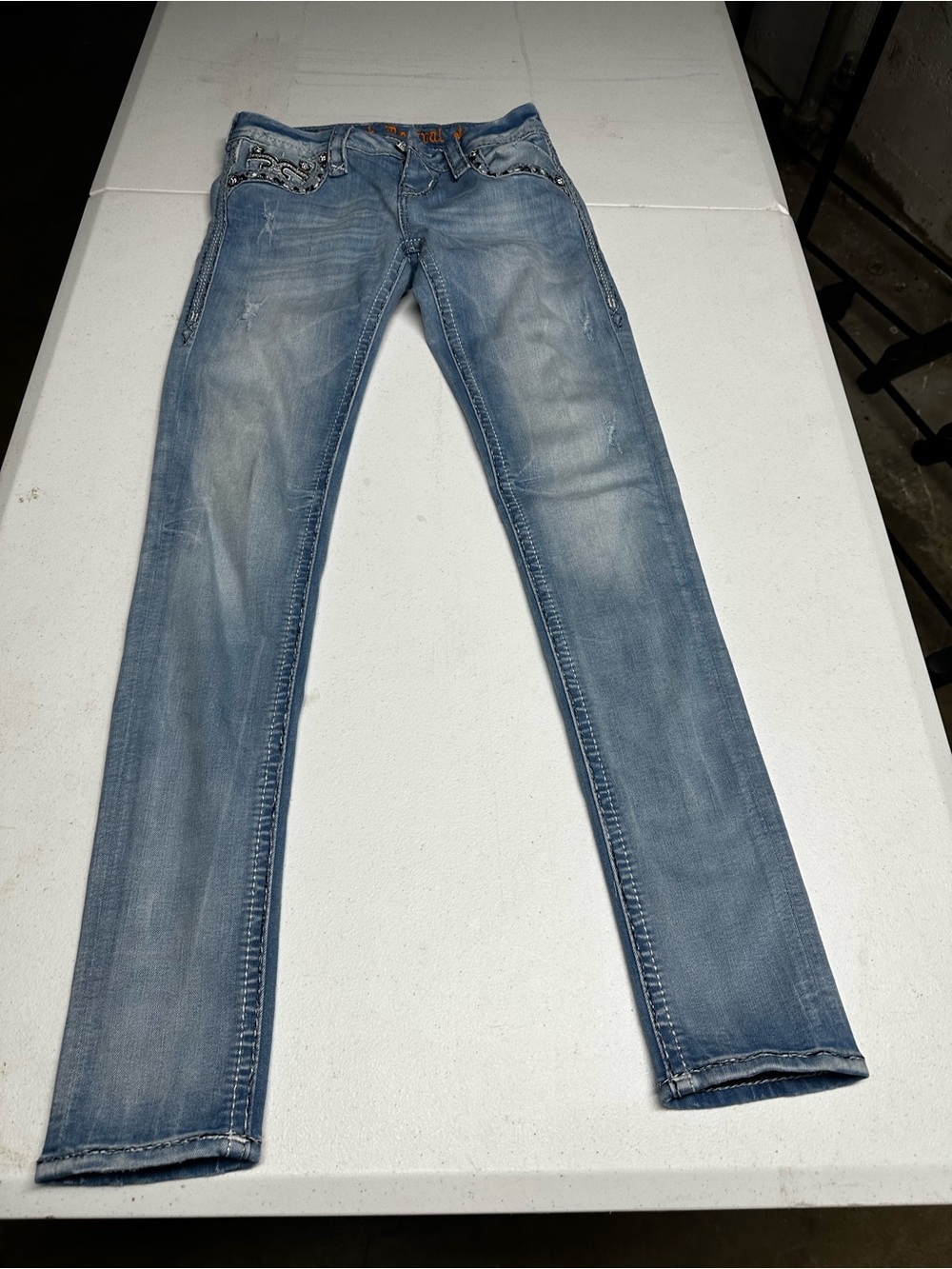 Rock Revival Light Wash Skinny Jeans with Studded Pocket Trim